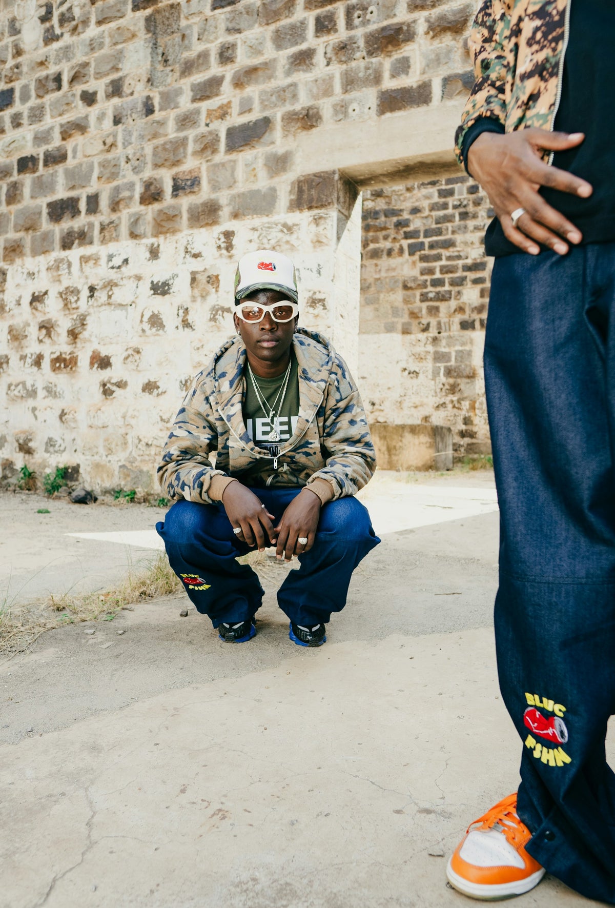 Two men in streetwear, photographed in Nairobi by Dwayne joe. Style inspiration, not a product listing.